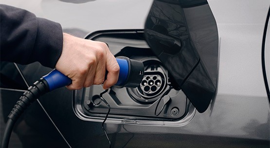 Electric vehicle being charged